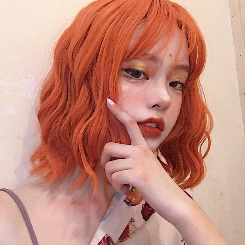 Short wig with a pixie cut for a bold and edgy lookOrange short curly wig YV43746