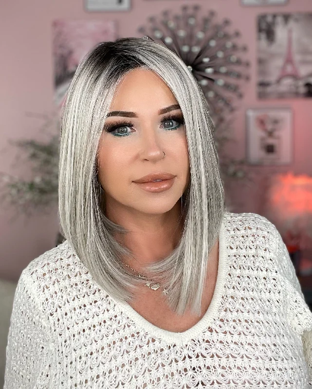 Medium - length wig with a platinum - blonde color for a bold and trendy lookClarissa Salt and pepper